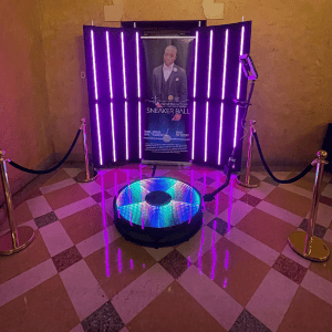 Photo booth with neon purple lights at Atlanta event venue.